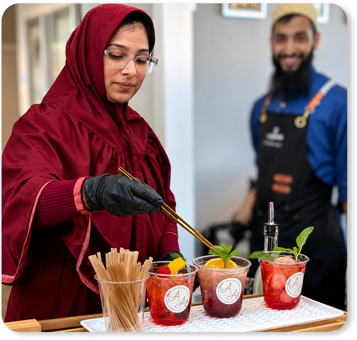 Sakina, founder of Talab Sips, garnishing signature mocktails
