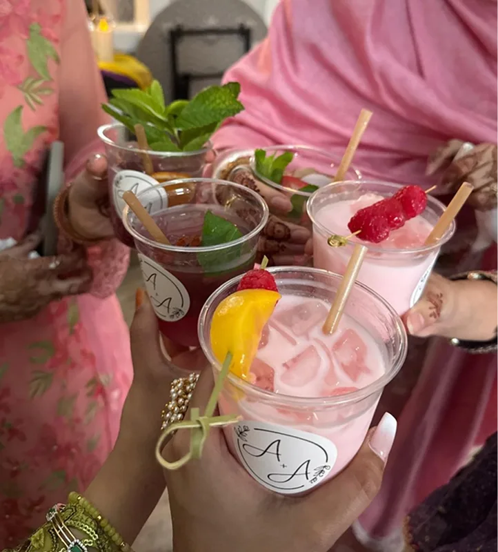 Guests toasting with pink mocktails